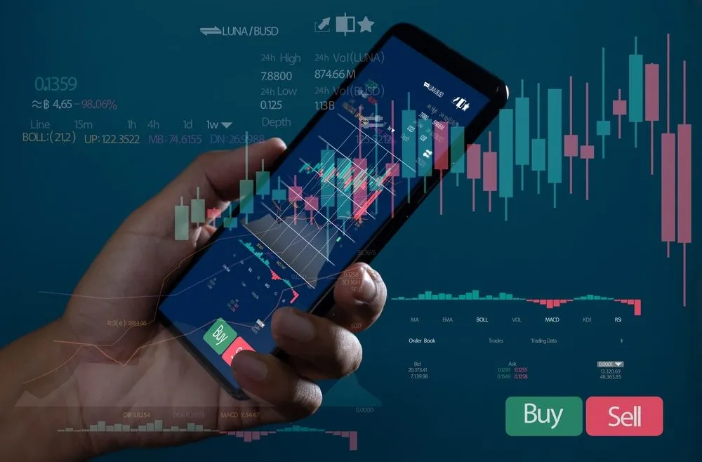 person trading on cellphone